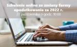 Ręka pisząca na komputerze, napis: Spotkanie online
