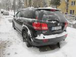 Samochód Dodge Journey koloru czarnego typ SUV.