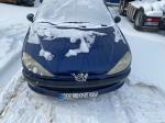 Samochód osobowy Peugeot 206  koloru granatowego. 