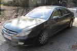 Peugeot 607 pojemność silnika 2179,00 cm³, rok produkcji 2004. Zdjęcie przedstawia lewy  bok zielonego samochodu