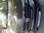 Samochód osobowy FIAT FREEMONT typu suv, kolor czarny. Przyciemnione tylne szyby. 