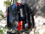 Samochód osobowy FIAT FREEMONT typu suv, kolor czarny. Przyciemnione tylne szyby. 